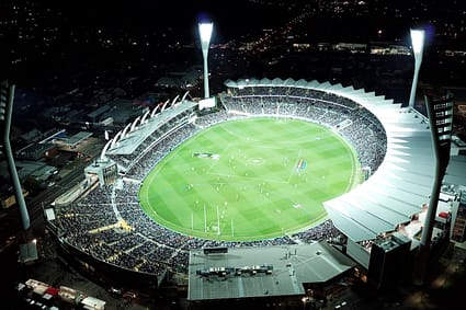 high-angle photo of round stadium at nighttime AFL